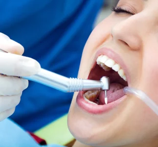 checkup-dentist-tool-instrument-young-scaled